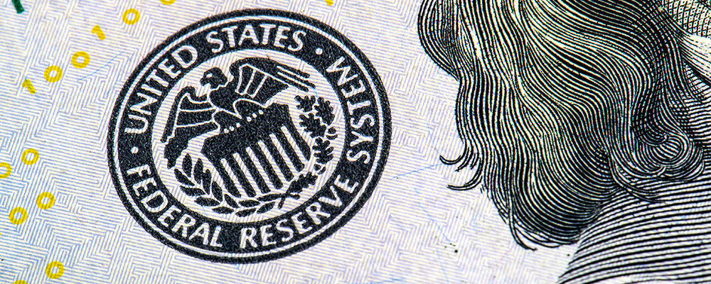 dollar rises on hawkish comments from fed official but risk assets stay resilient